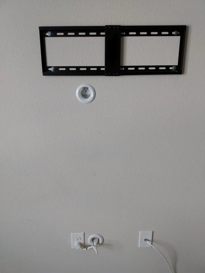 TV mount installed with a power bridge for internal cable concealment