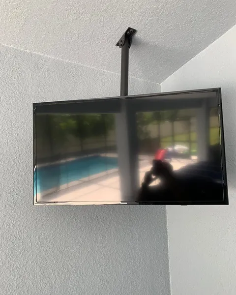 TV installed from the ceiling using a ceiling mount