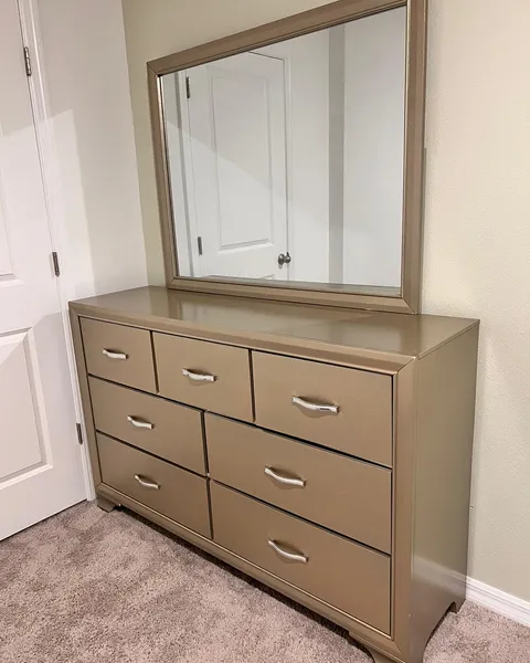 Mirror installed above a dresser by Pro Services