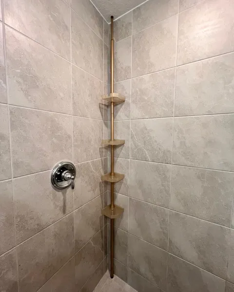 Adjustable shower organizer installed in a bathroom