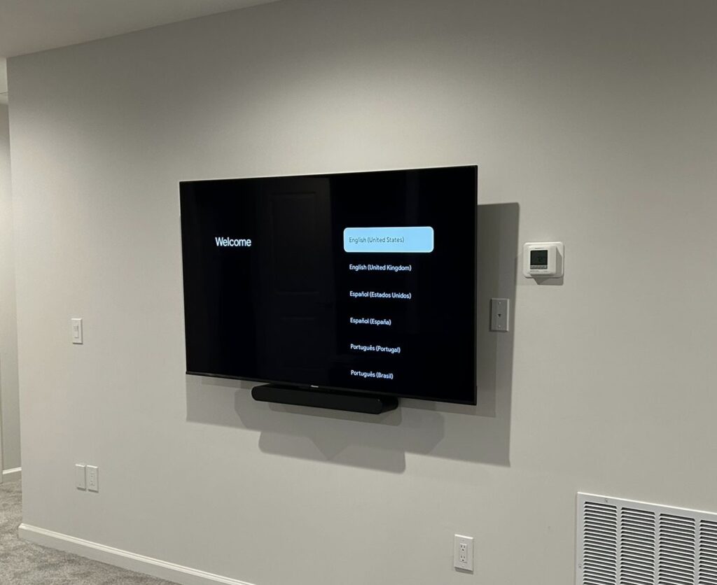 Tv installed with soundbar on a full motion mount