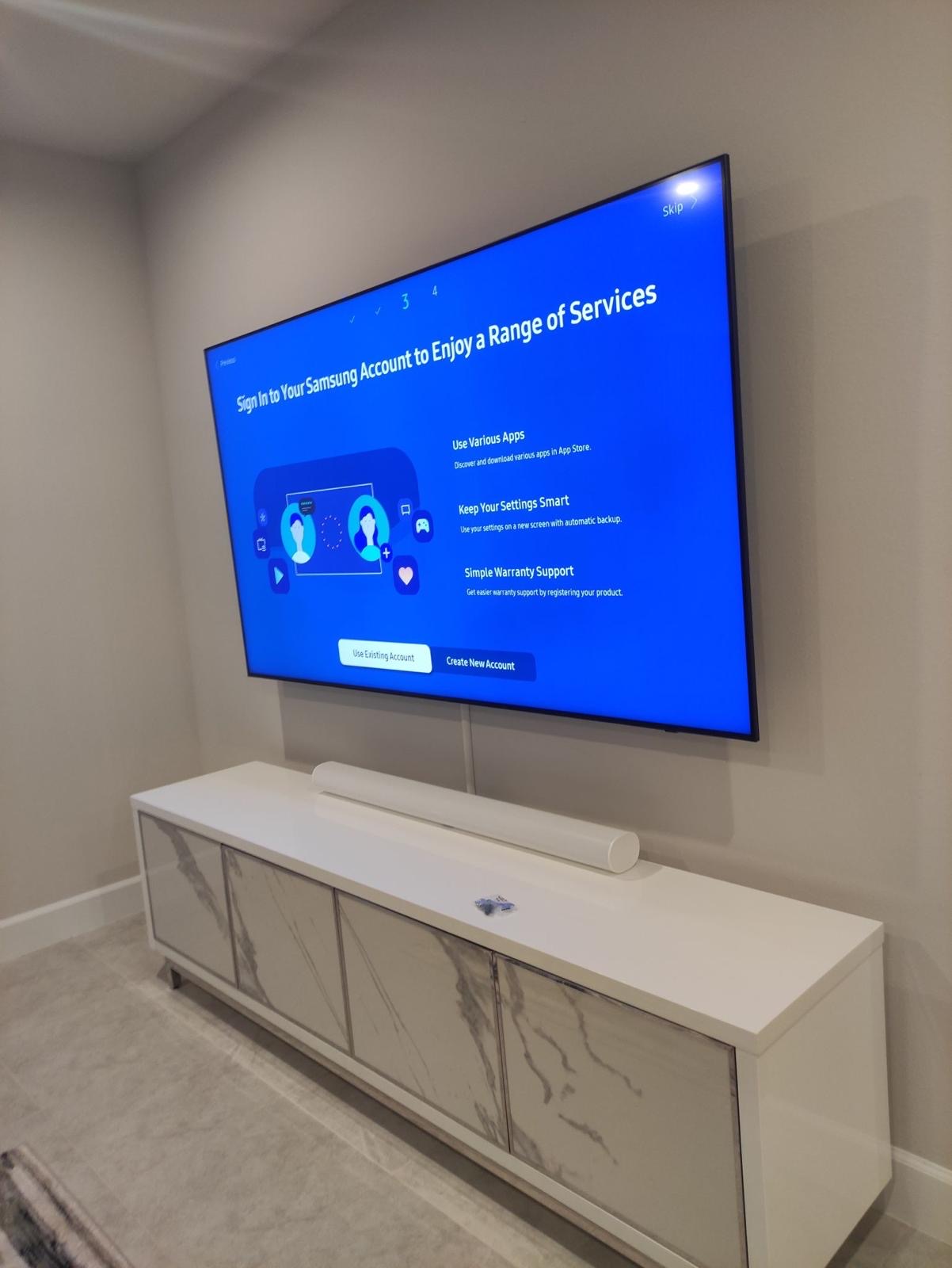 Pro services tech installed a tv on a full motion mount with a cover strip