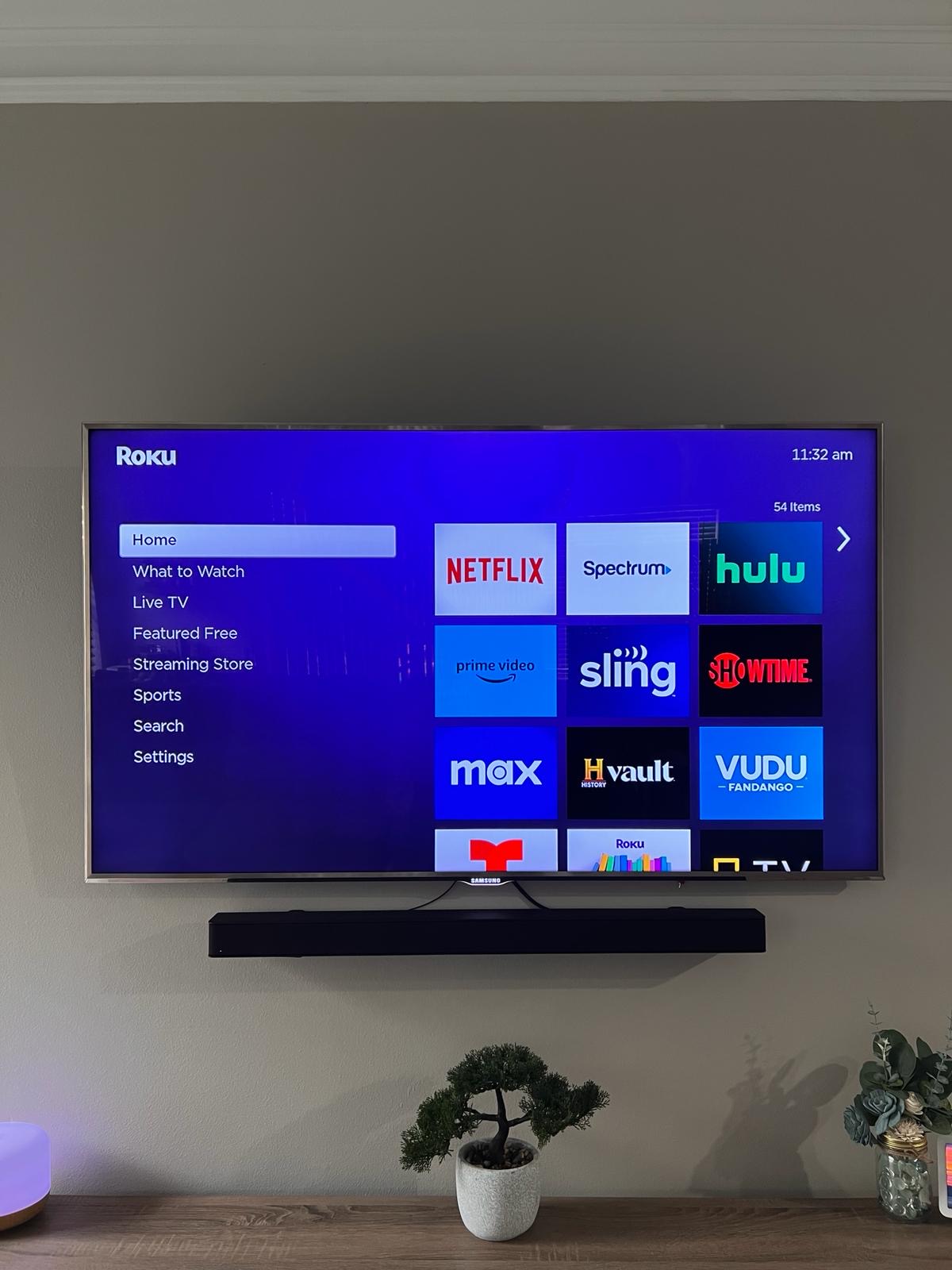 Pro services tech installed a tv on a tilt mount with a soundbar install and a power bridge