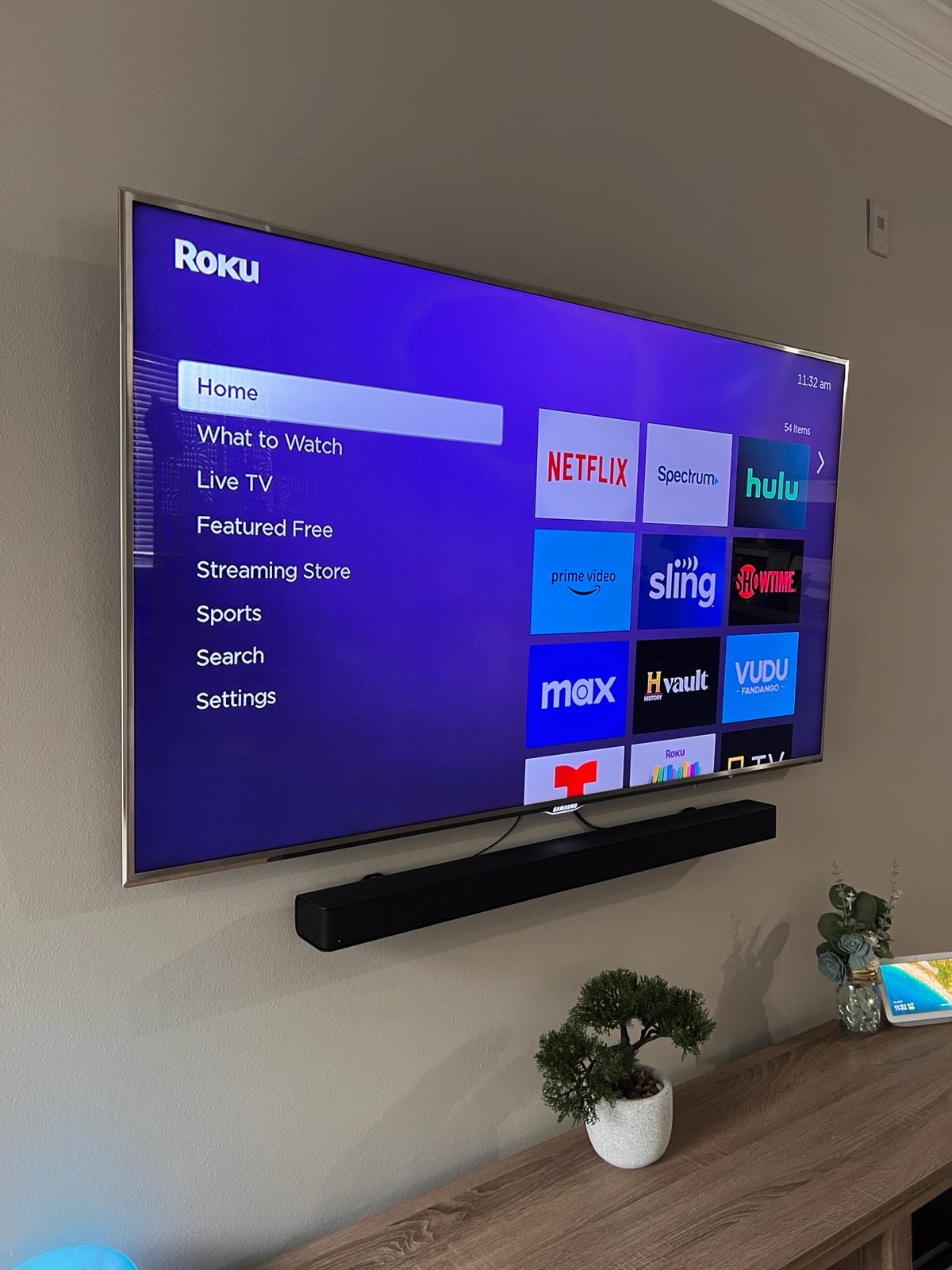 Pro services tech installed a tv on a tilt mount with a power bridge and soundbar installation