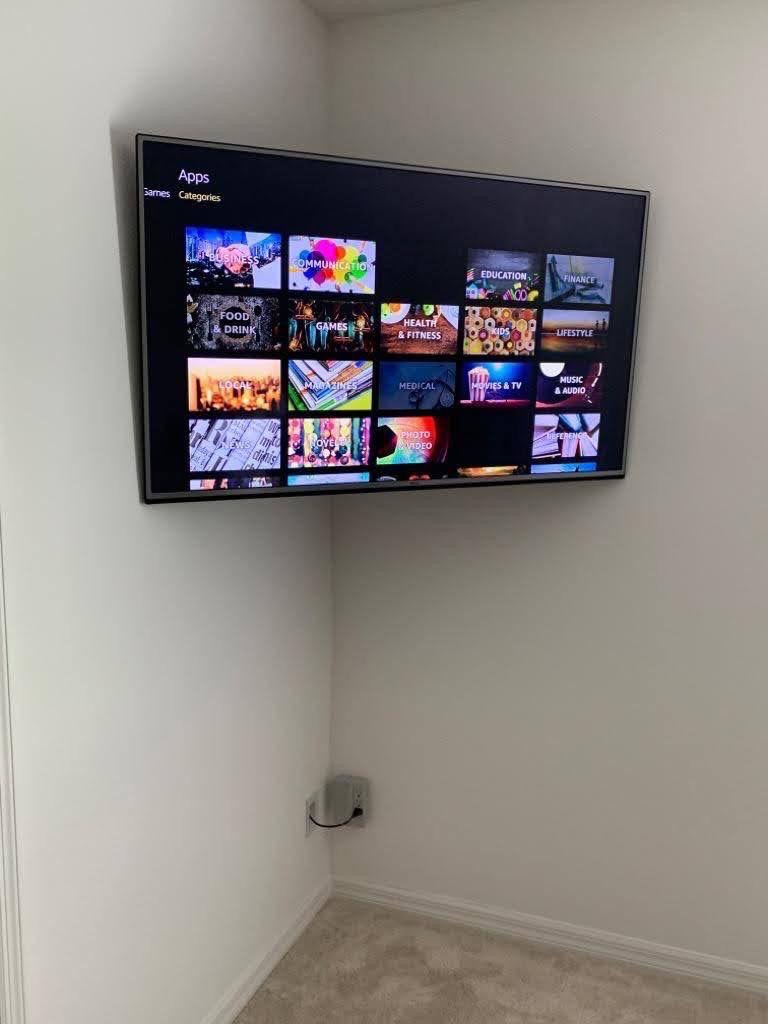 Corner mounted TV with power bridge